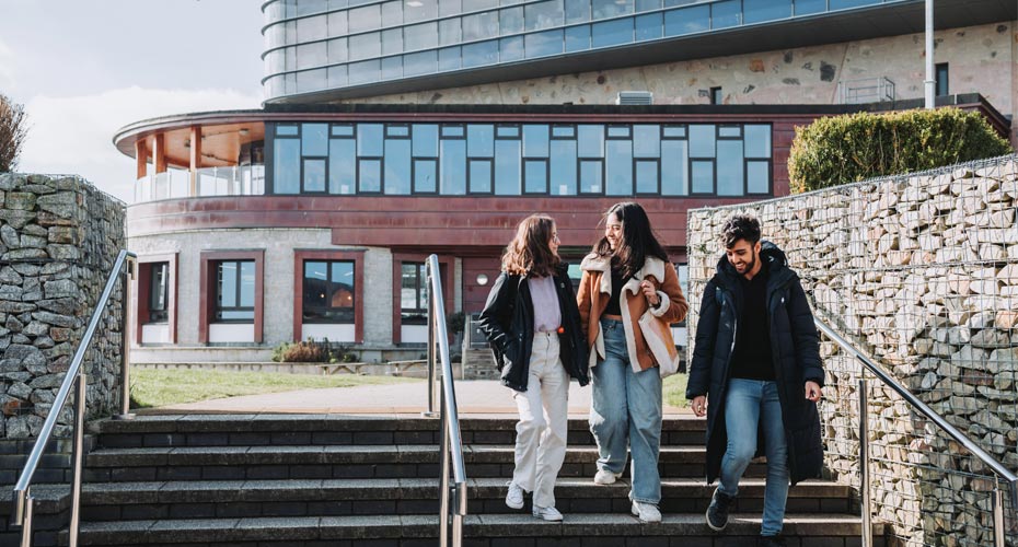 Students walking outside on the Penryn Campus
