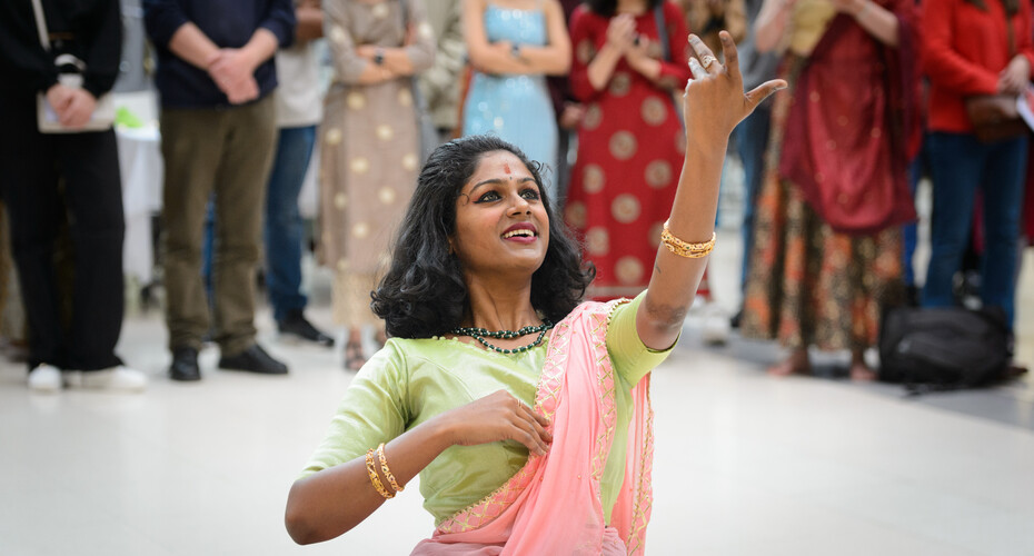A student dances for Diwali celebrations on campus