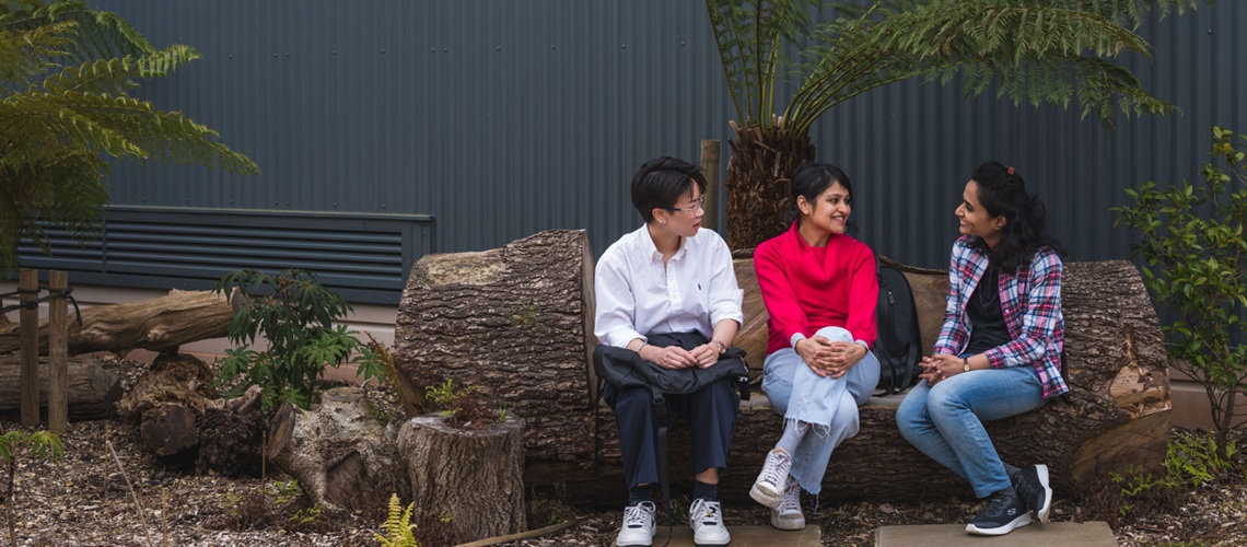 A group of Business School students sat talking together.