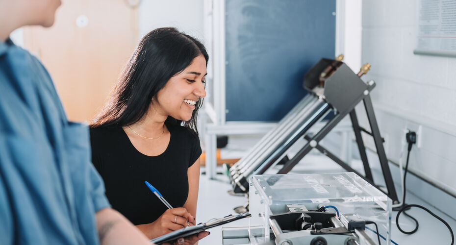 A Penryn Campus researcher holding a clipboard and pen