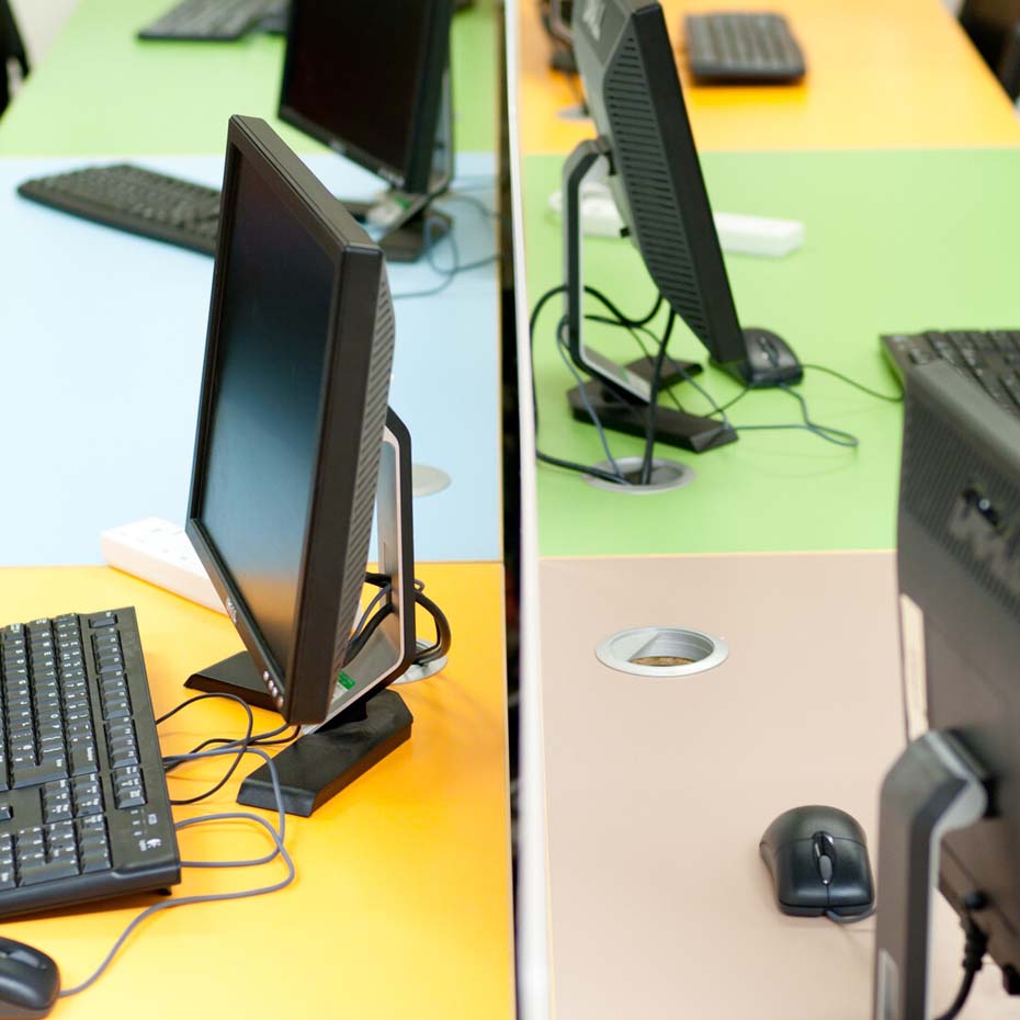 Two desks with computer screens