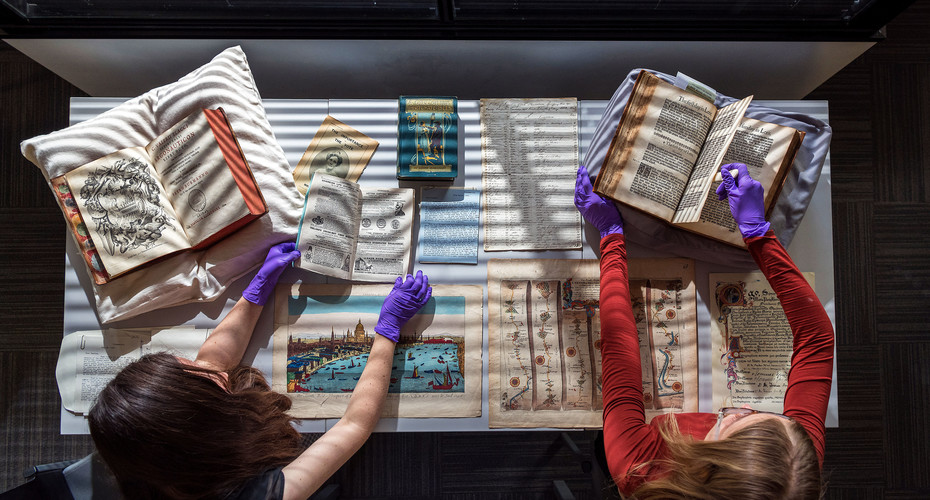 Students examining historical textbooks