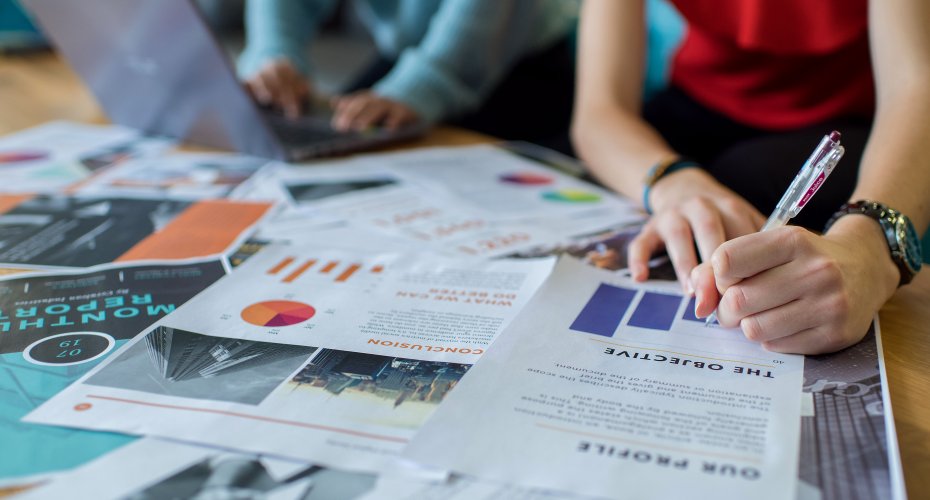 Student reading a brochure