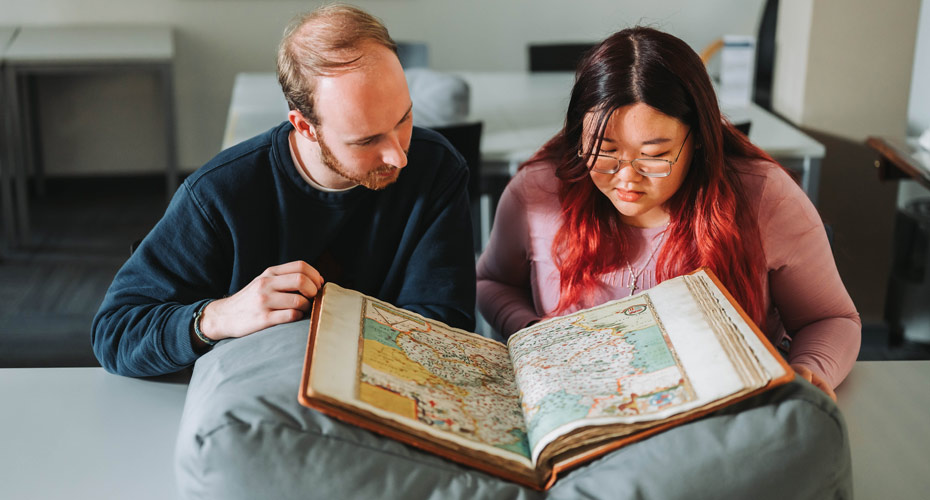 Students looking at Saxton Map in the Ronald Duncan Reading Room