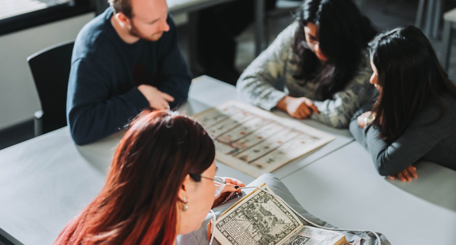 Students looking at material in the Ronald Duncan Reading Room