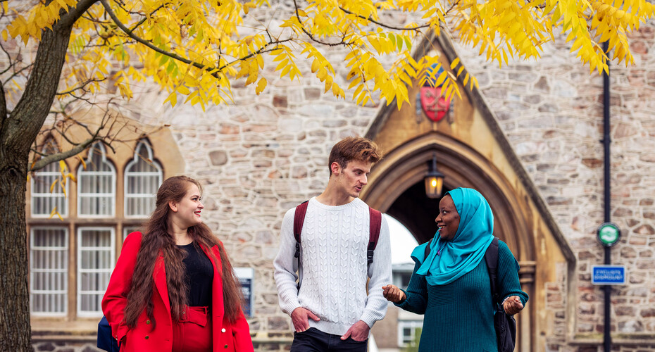 Three friends walking on St Lukes Campus