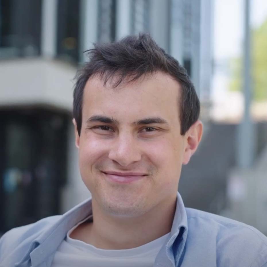Man in front of office building
