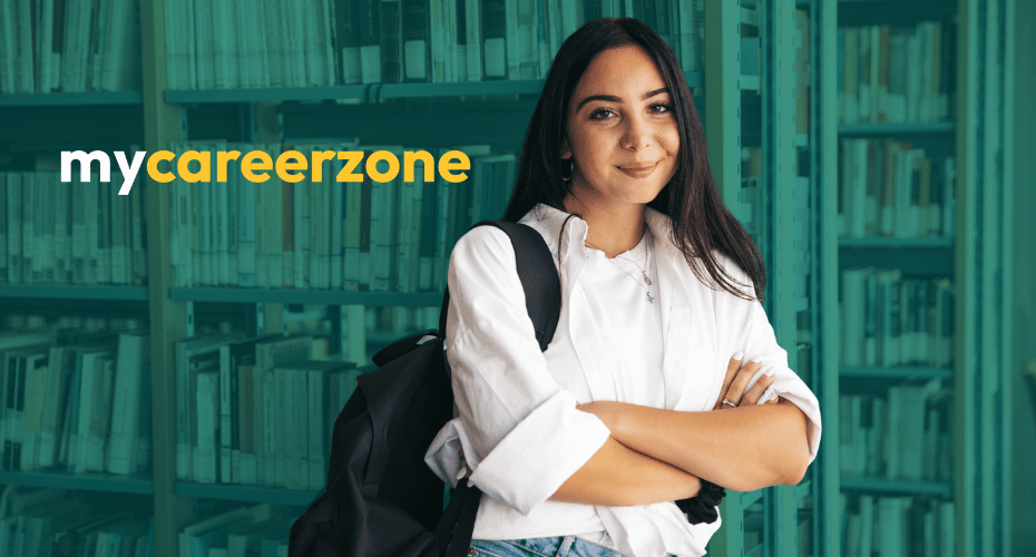 student in a white shirt against a background of green books