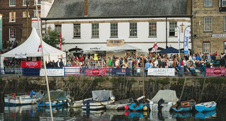 A view of boats in the water below the harbour festival in Falmouth