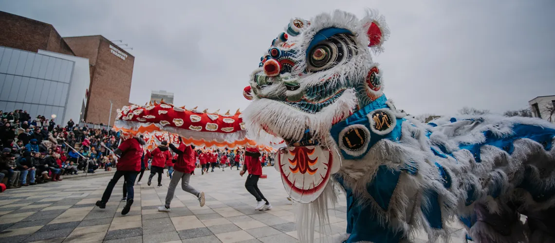Students celebrate Chinese New Year and entertain guests outside the Forum on Streatham Campus in Exeter.