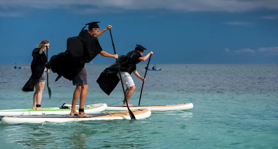Graduates on paddleboards