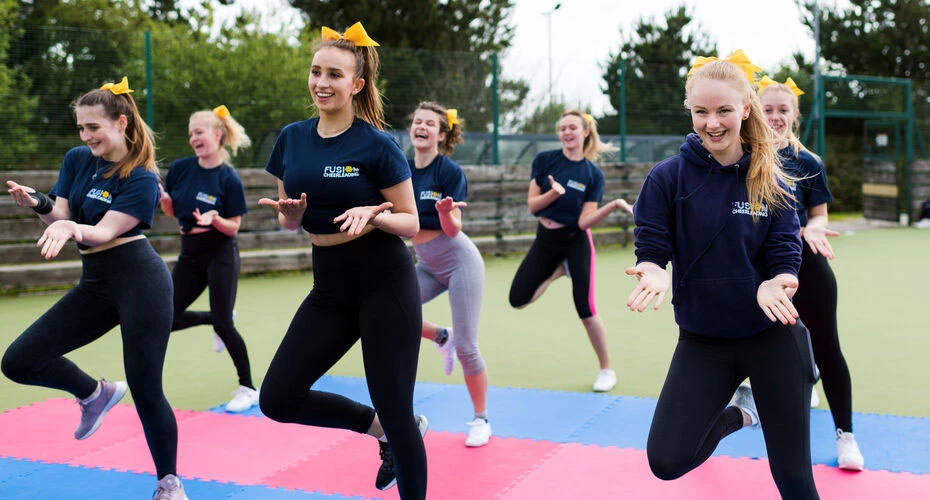 Cheerleaders practicing a routine