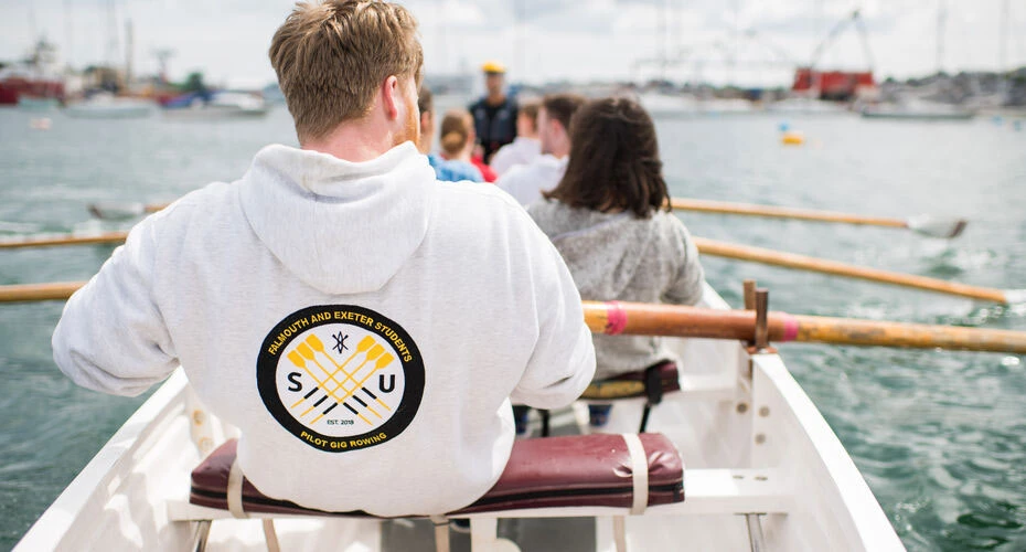 Student pilot gig rowing on the sea in Cornwall