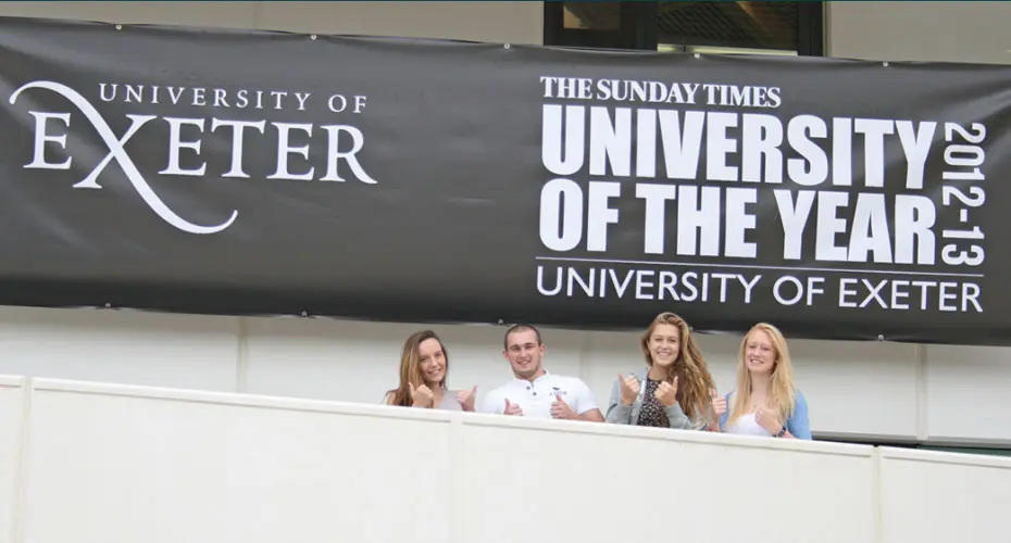 Students with banner for Times and The Sunday Times University of the Year