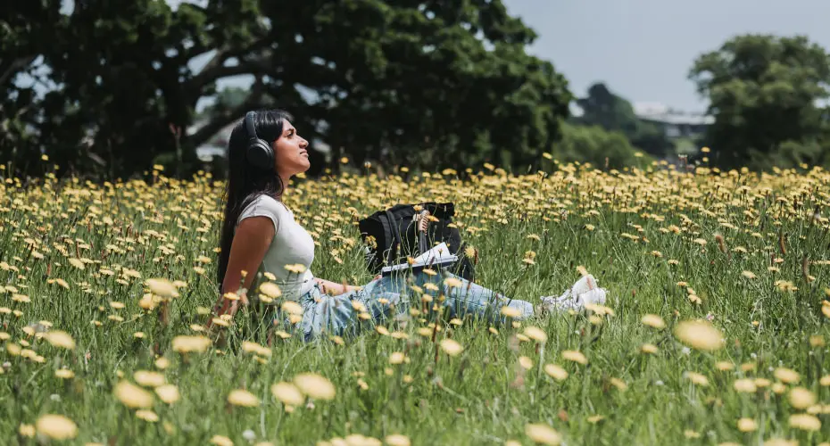 Student sat in a field