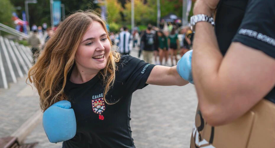A student trying out boxing at the Freshers Fair