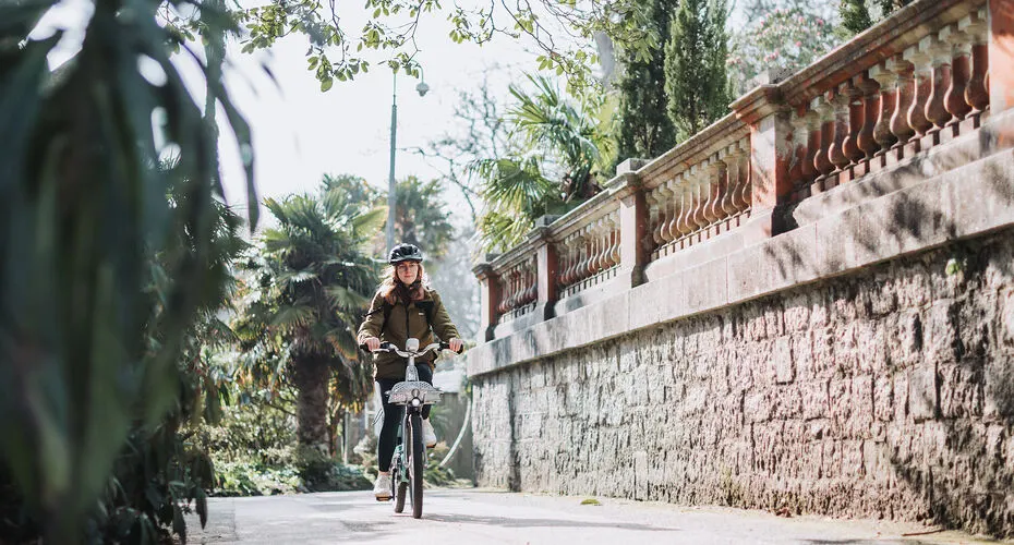 A student cycling on Penryn Campus