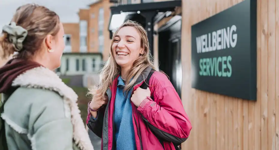 Students talking outside of Wellbeing Services