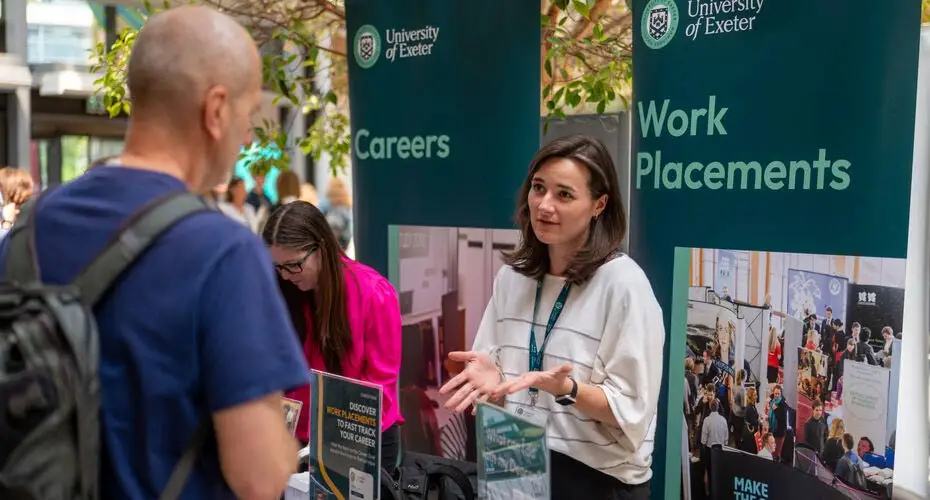 A member of staff from the Careers Service talking to a prospective student on an Open Day