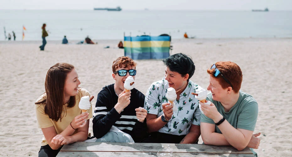 Students enjoying ice creams on Gilly beach