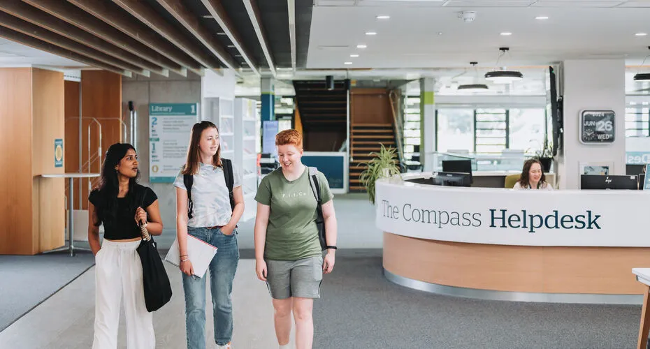 Students walking past reception in the Exchange building on Penryn Campus