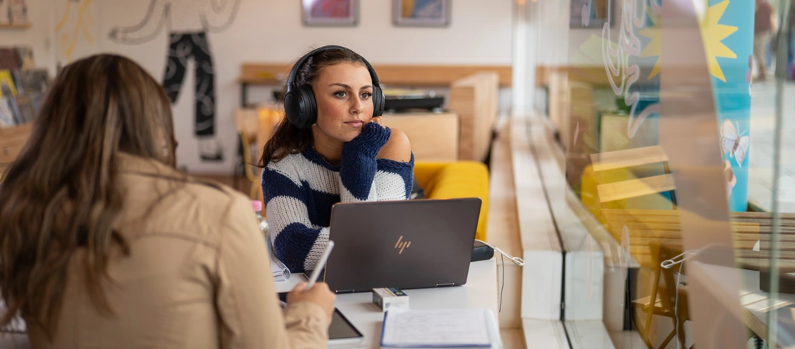 A University of Exeter student studying in a café in the city centre.