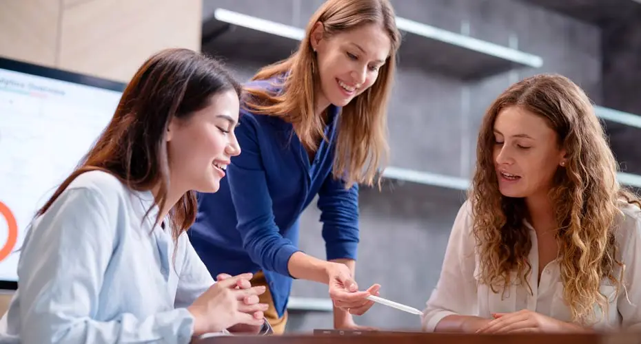 A group of Project Management Apprenticeship students working together