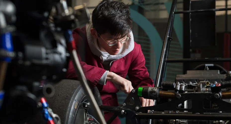 An engineering student building a car