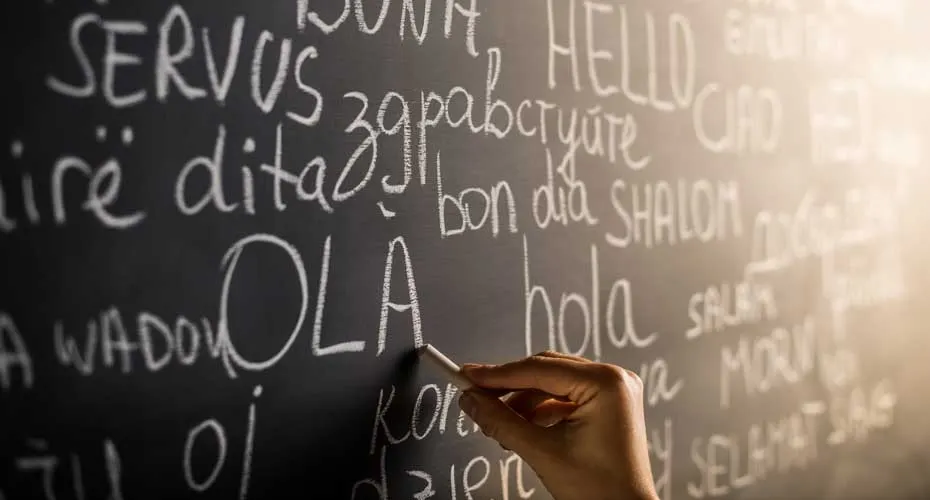 A blackboard containing numerous translations of the word 