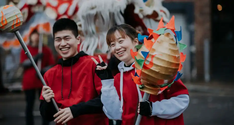 A pair of students engaging in a cultural celebration