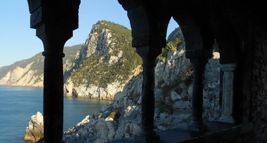 An Italian cliff edge featuring arches.