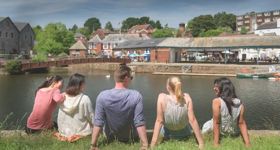 A group of students from the university enjoying student life at the Quay in Exeter